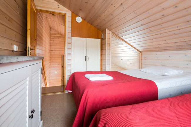 Dormitorio del apartamento clase Superior en el hotel Ounasvaara Chalets 